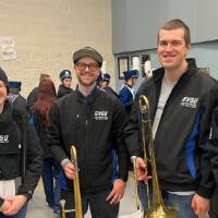 3 trombone alumni and one baritone alum in the band room